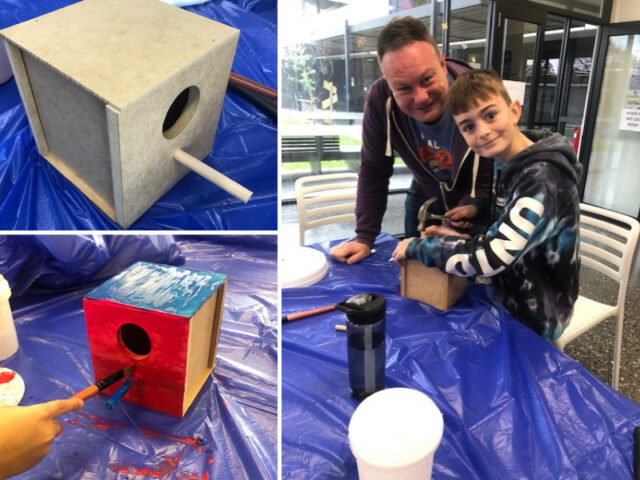 building and painting wooden birdhouses on blue tablecloth