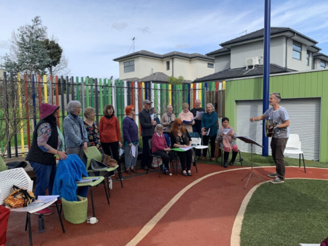 choir practice outdoors in childrens play area