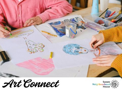 People drawing with crayons and pencils at a table, creating colourful self-portrait artworks, with &ldquo;Art Connect&rdquo; and Sussex Neighbourhood House branding displayed.
